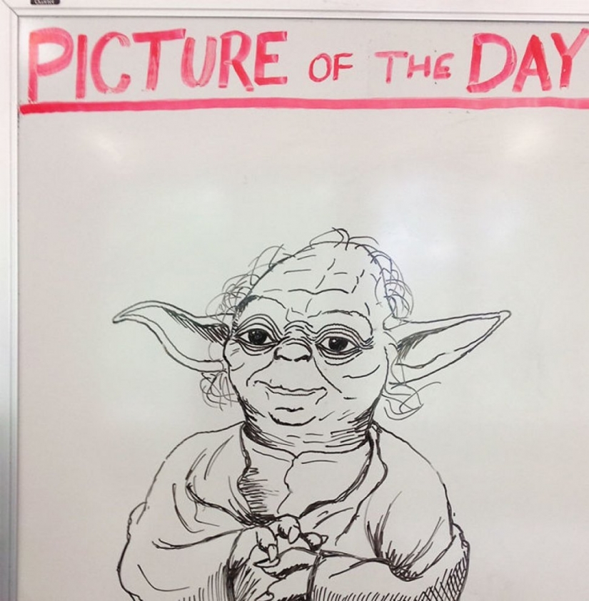 Creative history teacher every day draws pictures on the Board