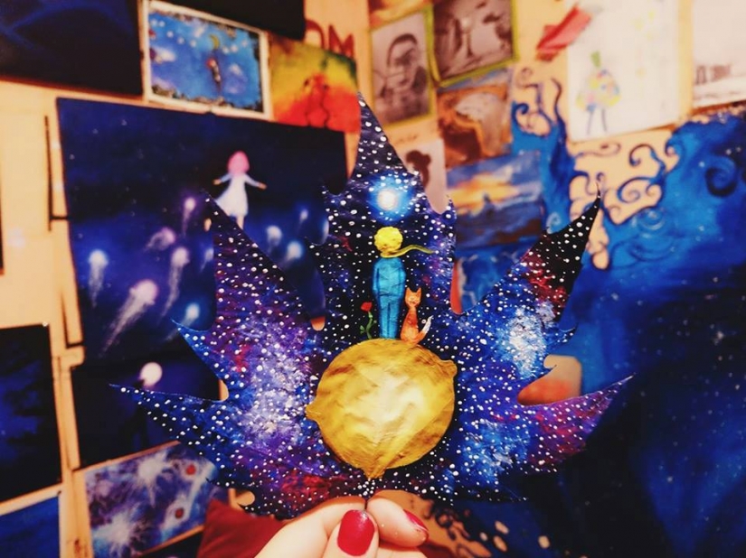 Fantasy worlds on a dry maple leaf