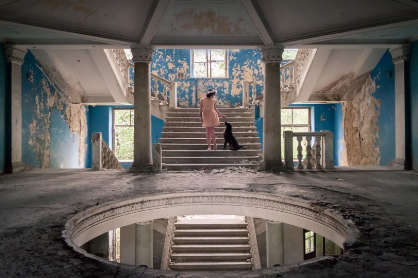Guy photographing his girlfriend in an abandoned locations across Europe