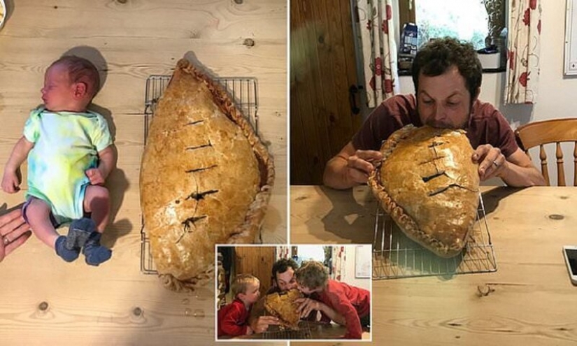 Happy father in honor of the birth of his son baked a cake the size of a child