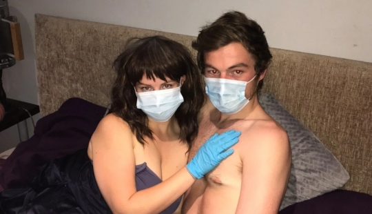 Safe sex: British woman with coronafobia making love only in a mask and gloves