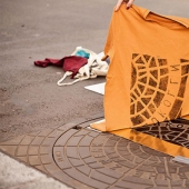 The Berlin artists make prints on t-shirts with the help of manholes