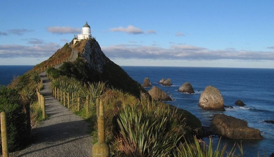 The lighthouse of Nugget point in New Zealand The lighthouse of Nugget point in New Zealand