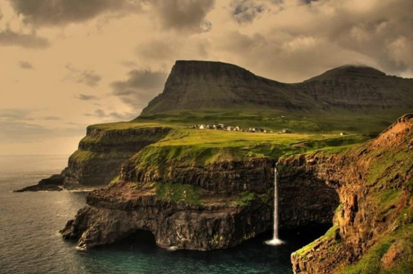 The picturesque village of Gasadalur is the most beautiful place of Faroe Islands The picturesque village of Gasadalur is the most beautiful place of Faroe Islands