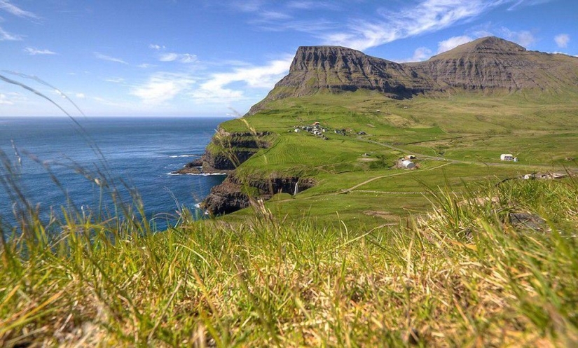 The picturesque village of Gasadalur is the most beautiful place of Faroe Islands The picturesque village of Gasadalur is the most beautiful place of Faroe Islands