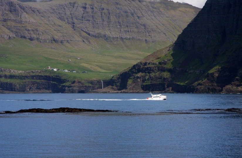 The picturesque village of Gasadalur is the most beautiful place of Faroe Islands The picturesque village of Gasadalur is the most beautiful place of Faroe Islands