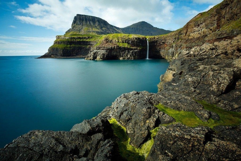 The picturesque village of Gasadalur is the most beautiful place of Faroe Islands The picturesque village of Gasadalur is the most beautiful place of Faroe Islands