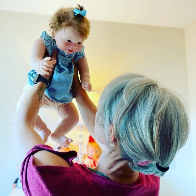 American woman takes care of realistic babies to drown out the pain of parting with her own children