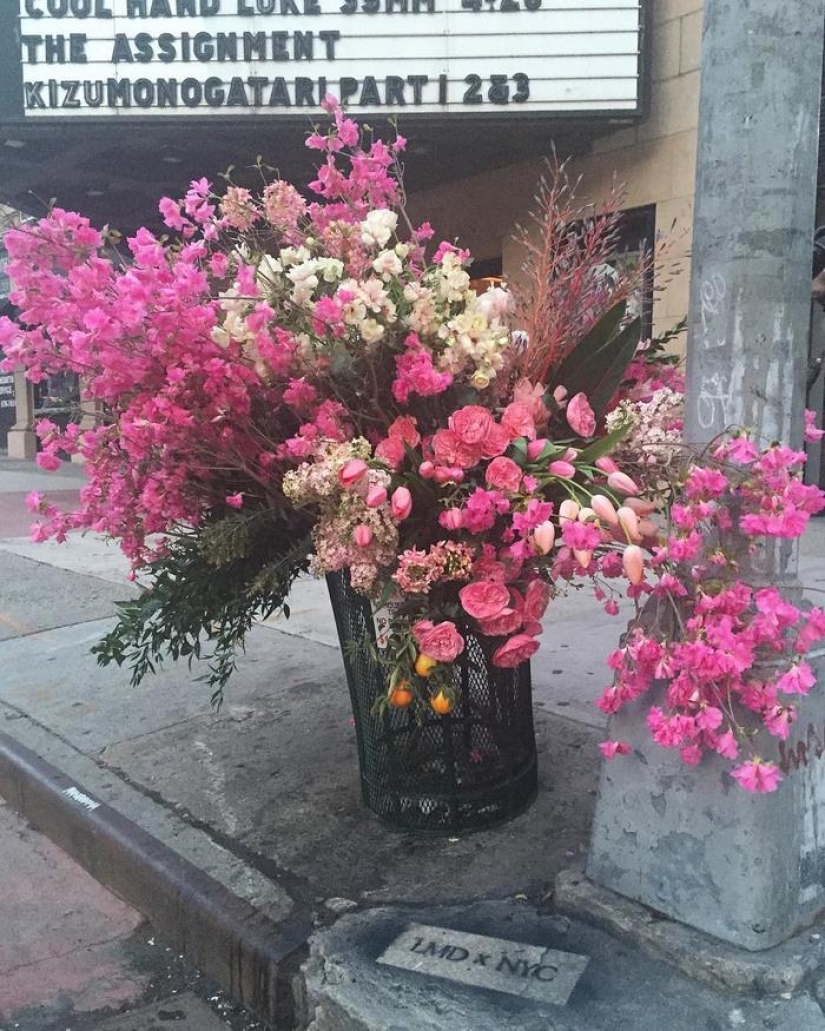 Crime or art? Someone is turning New York City trash cans into giant vases of flowers.