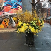 Crime or art? Someone is turning New York City trash cans into giant vases of flowers.