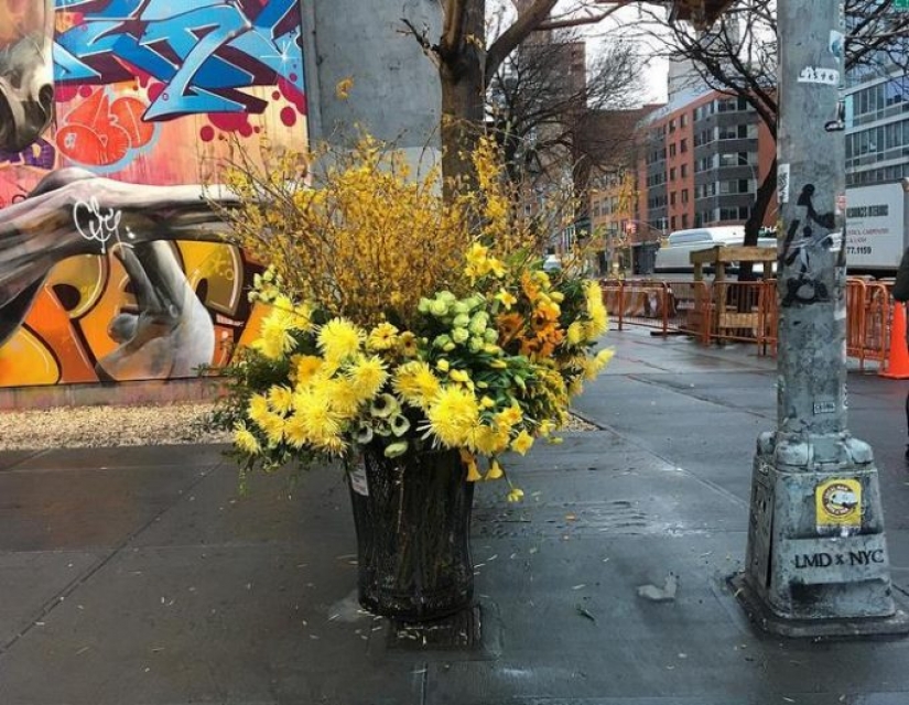 Crime or art? Someone is turning New York City trash cans into giant vases of flowers.
