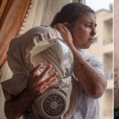 Due to a rare allergy to the sun, a woman from Morocco walks in a spacesuit