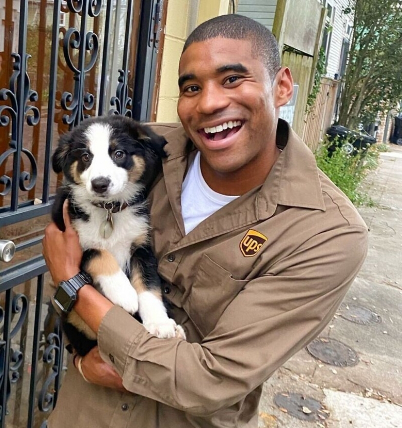 Funny courier photographed with every dog he meets