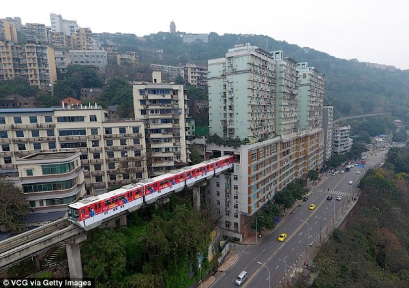 In China, a train passes right through a residential building