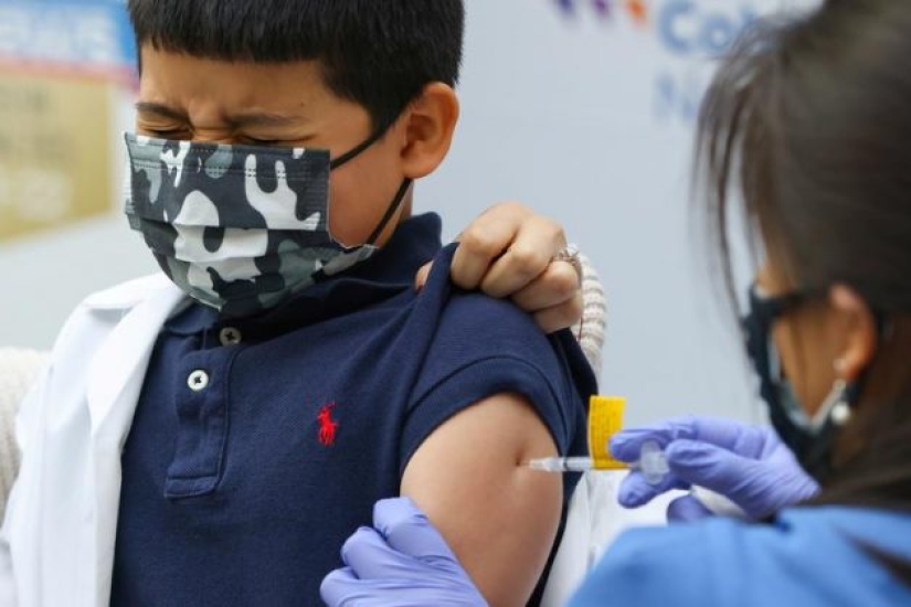 In photos: children in the US receive a vaccine from COVID