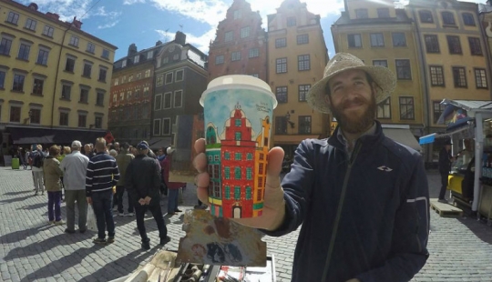 No art without a glass: a traveler paints coffee cups for a living