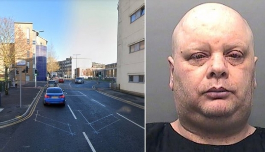 Silent protest: A British man has been standing in the middle of the road in the same place for seven years, creating traffic jams