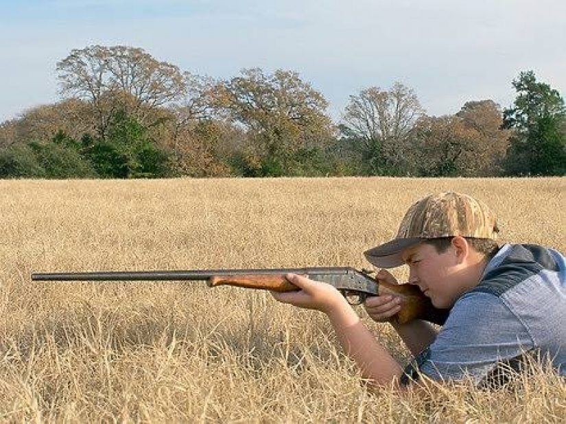 Taught to kill: children show off their hunting trophies after the opening of the teen season in Texas