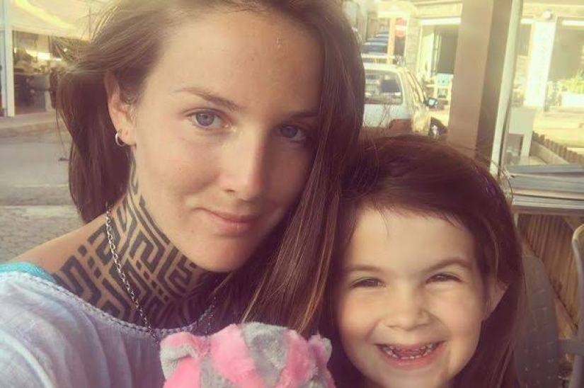 The cool kid: a seven-year-old biker rides a motorcycle with her mother, who loves extreme sports