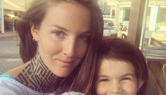 The cool kid: a seven-year-old biker rides a motorcycle with her mother, who loves extreme sports