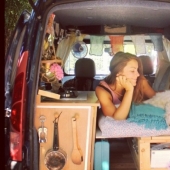 The girl has converted an old van into a motorhome and travels the world with his dog