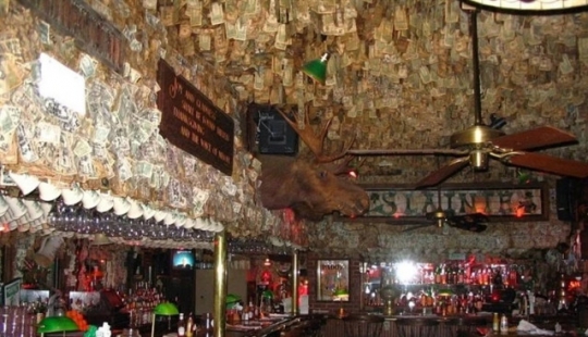 This pub in Florida is decorated with bills totaling two million dollars This pub in Florida is decorated with bills totaling two million dollars
