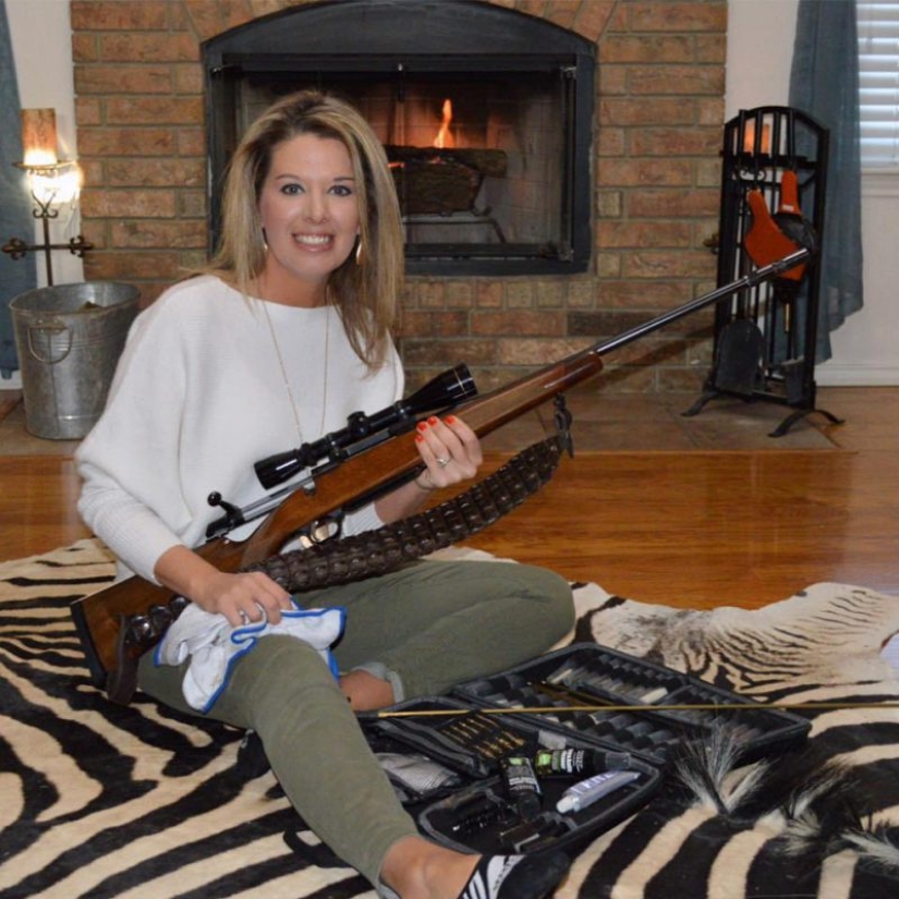 A bloodthirsty huntress killed a rare black giraffe and sewed a holster from its skin