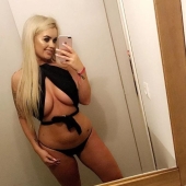 A British woman has hit the jackpot in the lottery, but still sells photos of her breasts online