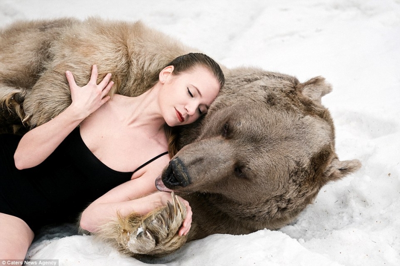 A snowy photo shoot of two models from Russia in an embrace with a bear shocked Europe