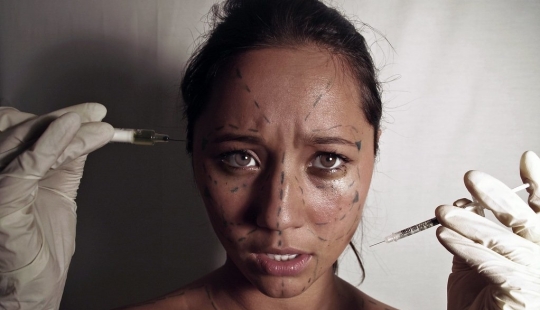 Big breasts — big debts: a single mother is mired in loans because of a passion for plastic surgery