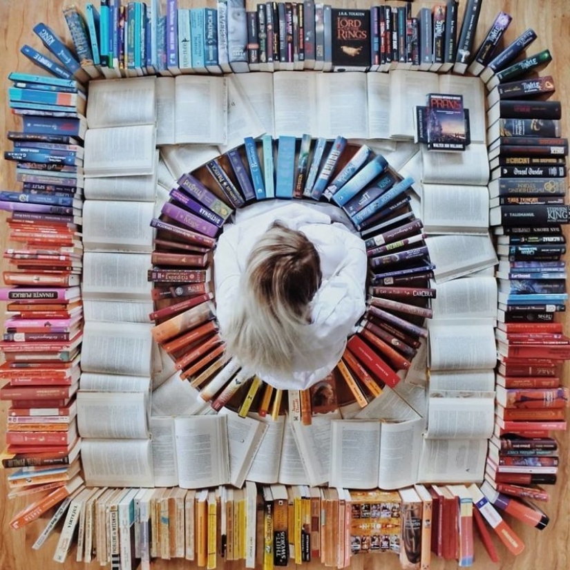 Books as art: a girl puts out colorful installations from her library Books as art: a girl puts out colorful installations from her library