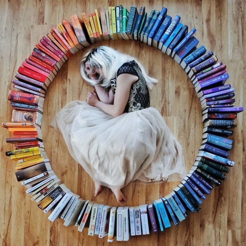 Books as art: a girl puts out colorful installations from her library Books as art: a girl puts out colorful installations from her library
