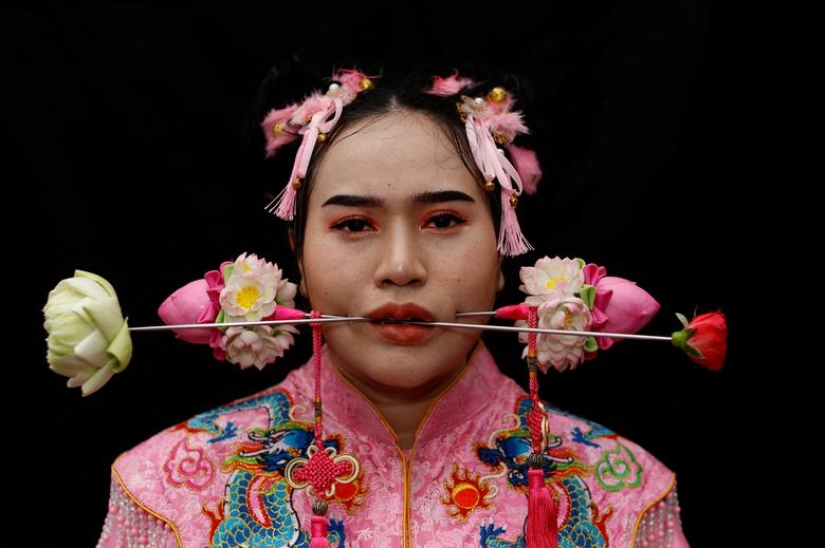 Extreme piercings put devotees in soul-cleansing trance at Thai festival Extreme piercings put devotees in soul-cleansing trance at Thai festival