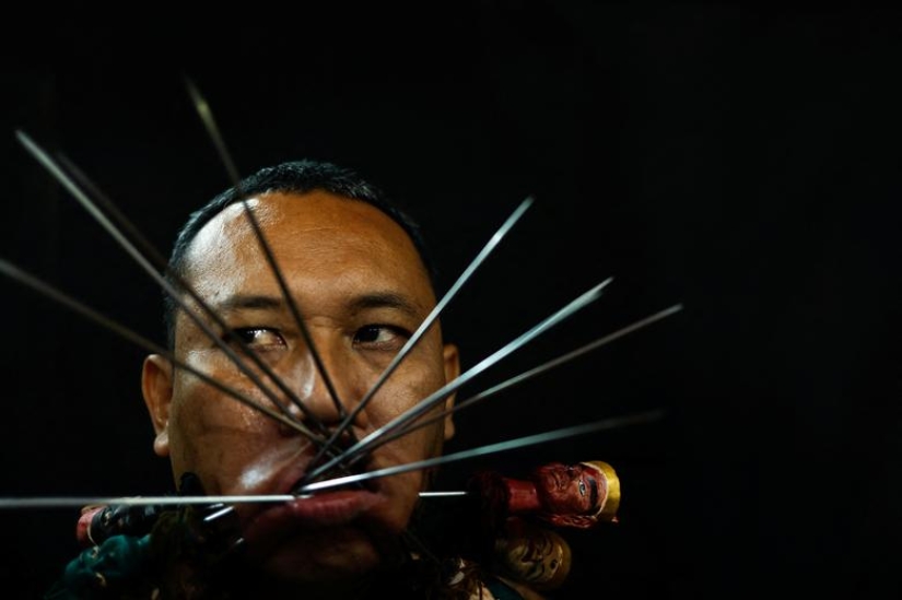Extreme piercings put devotees in soul-cleansing trance at Thai festival Extreme piercings put devotees in soul-cleansing trance at Thai festival