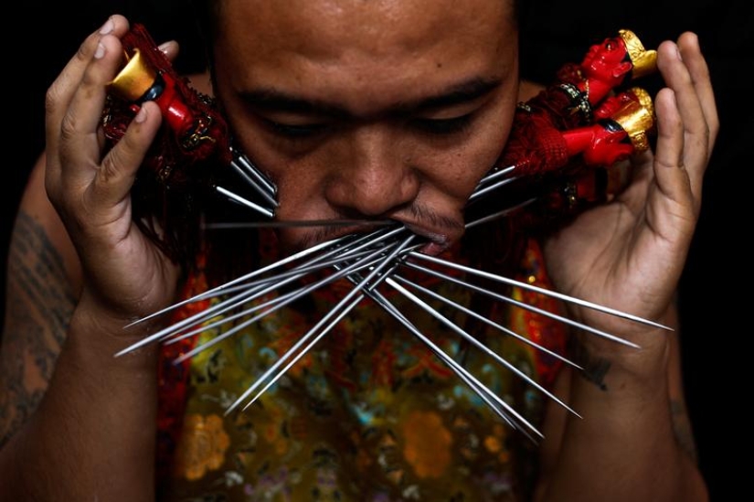 Extreme piercings put devotees in soul-cleansing trance at Thai festival Extreme piercings put devotees in soul-cleansing trance at Thai festival