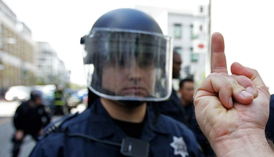 It is not prohibited by law: in the USA, you can show the police the middle finger, but it is better not to
