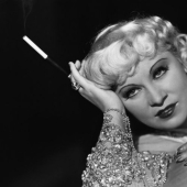 Mae West is a scandalous actress who became America's first sex symbol