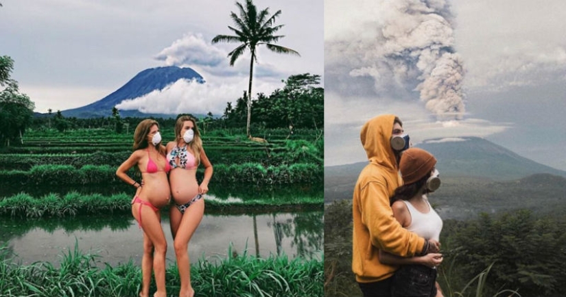 Mientras los residentes de Bali se alejan del volcán, los turistas son fotografiados con el telón de fondo de las emisiones de cenizas