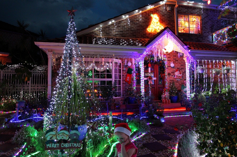 New Year and Christmas in Australian style: kangaroos instead of deer and Santa on a board with a paddle New Year and Christmas in Australian style: kangaroos instead of deer and Santa on a board with a paddle