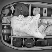 Photographers take pictures of their tiny children in photo bags