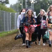 Rubber mood: Glastonbury greets participants in raincoats and with a killer dose of alcohol