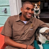 The courier guy loves his job. All because he is allowed to squeeze other people's dogs