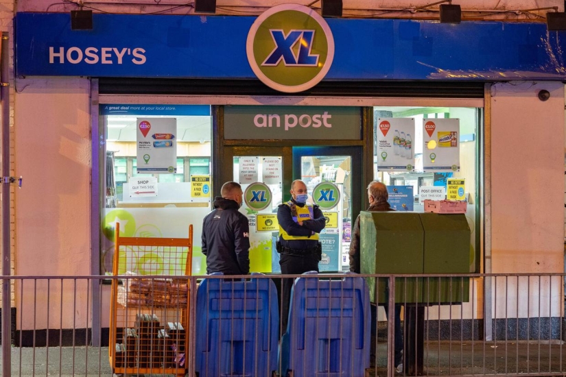 Two Irishmen brought the body of a deceased friend to the post office to receive his pension Two Irishmen brought the body of a deceased friend to the post office to receive his pension
