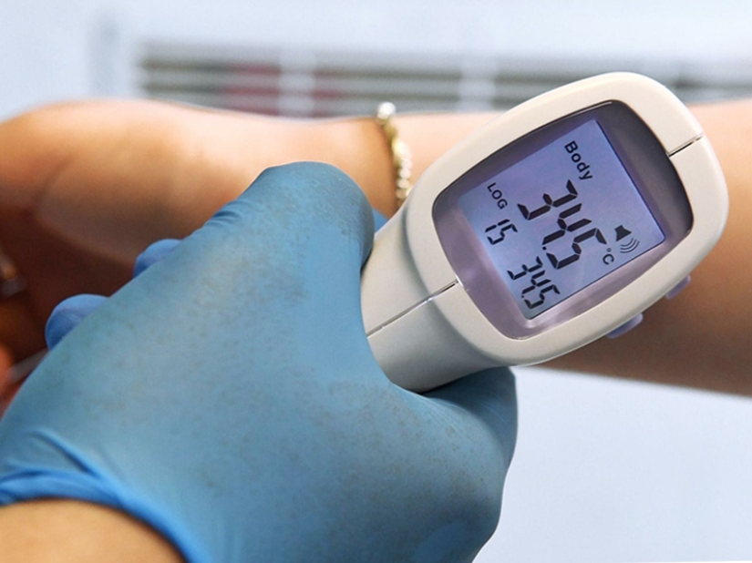 Why do some people put a thermometer under their arm, others in their mouths, and some...