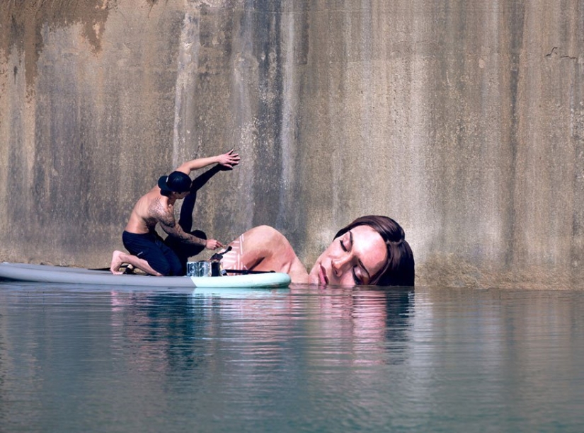Women coming out of the water — the creation of an artist balancing on a surfboard