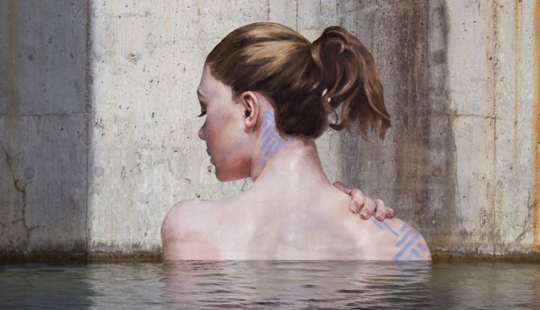 Women coming out of the water — the creation of an artist balancing on a surfboard Women coming out of the water — the creation of an artist balancing on a surfboard