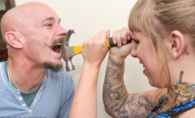 A British woman dropped out of university for a circus performance where she drives nails into her father's nose