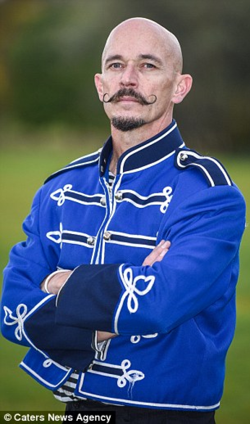 A British woman dropped out of university for a circus performance where she drives nails into her father's nose