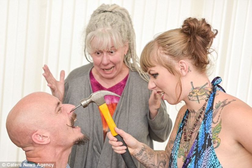 A British woman dropped out of university for a circus performance where she drives nails into her father's nose