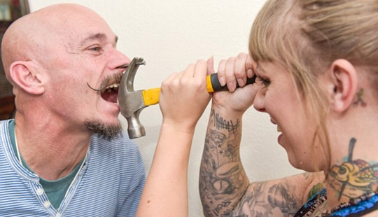 A British woman dropped out of university for a circus performance where she drives nails into her father's nose